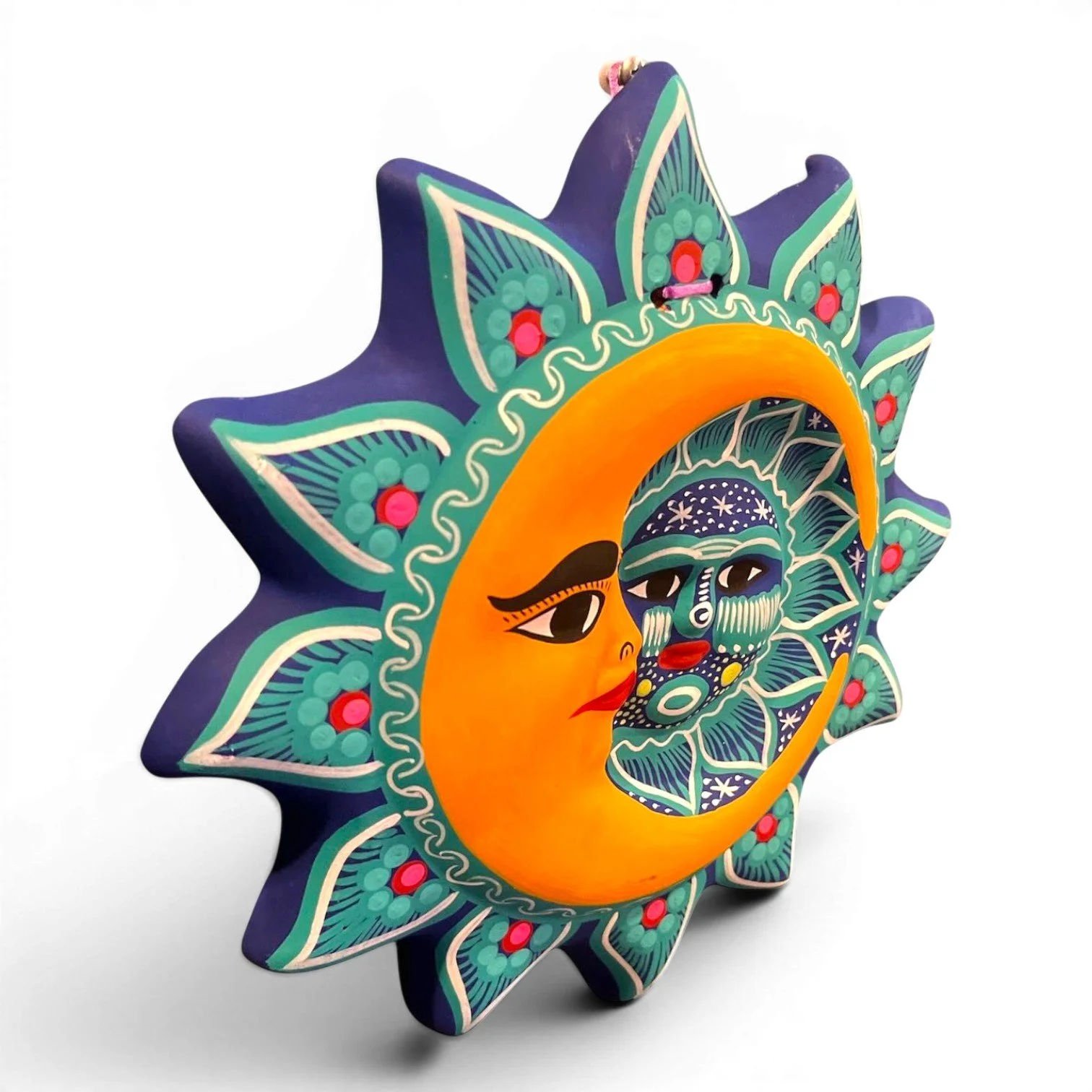 Handmade Arcilla Sol y Luna clay wall art from Oaxaca, Mexico featuring a colorful hand-painted sun and moon design.