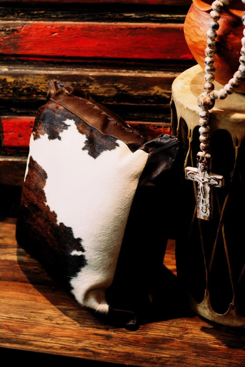 Shop a handmade cowhide and leather pillow from Brazil. Rustic luxury accent pillow with unique patterns for sofas, chairs, and home decor.