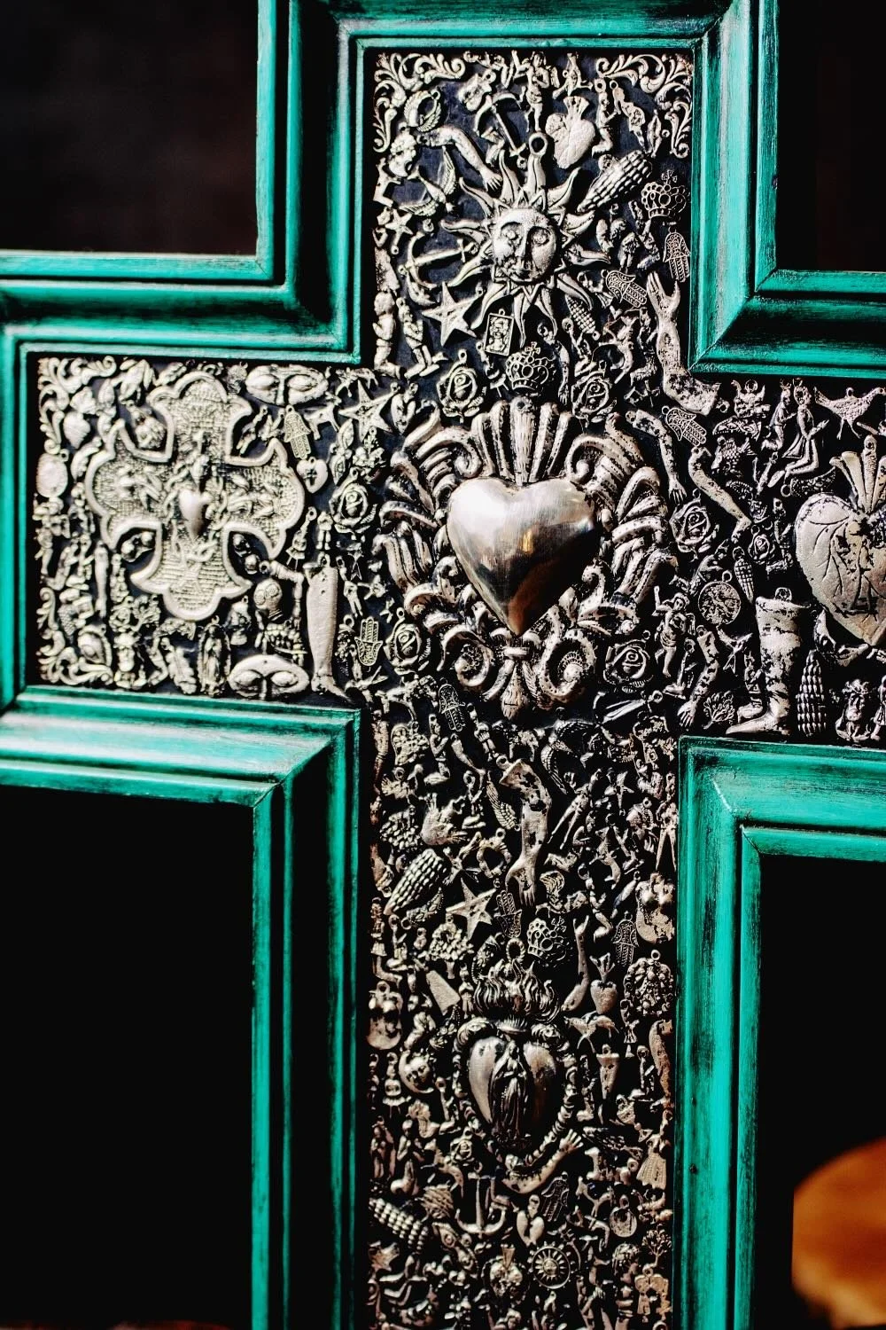 Cruz Milagros Grande Turquesa - Shop a large handmade Milagros cross from Mexico. Turquoise wooden wall decor with symbolic charms and rustic artisan craftsmanship.