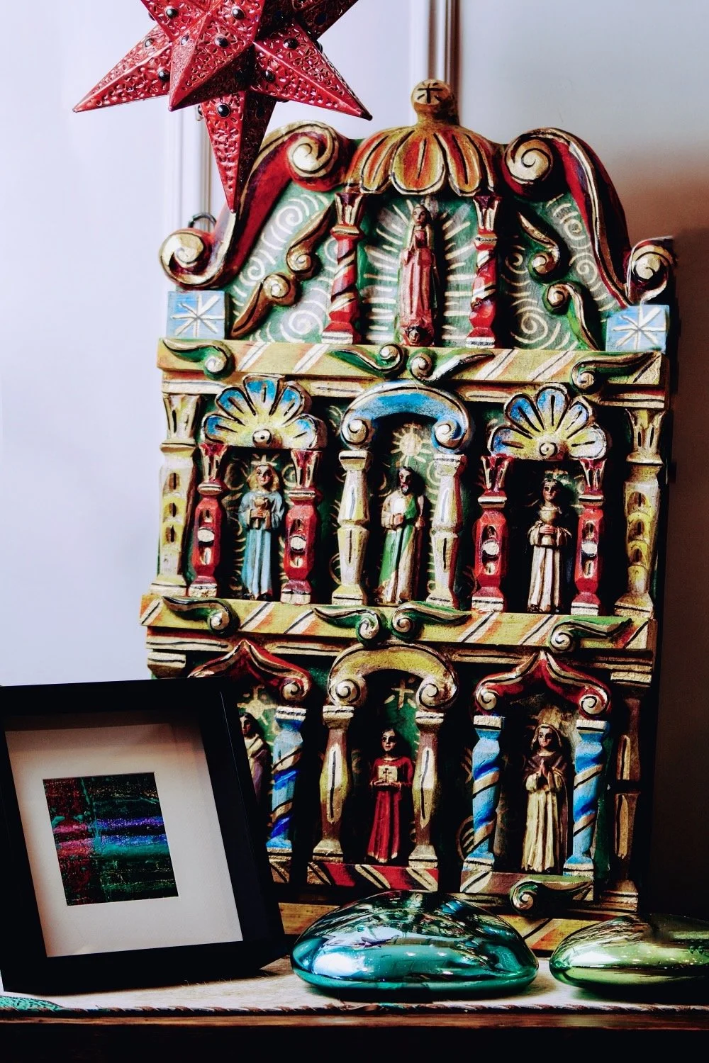 Beautiful and colorful Retablo, hanging red star, abstract Rich Helmer photography and handblown glass pebbles. 