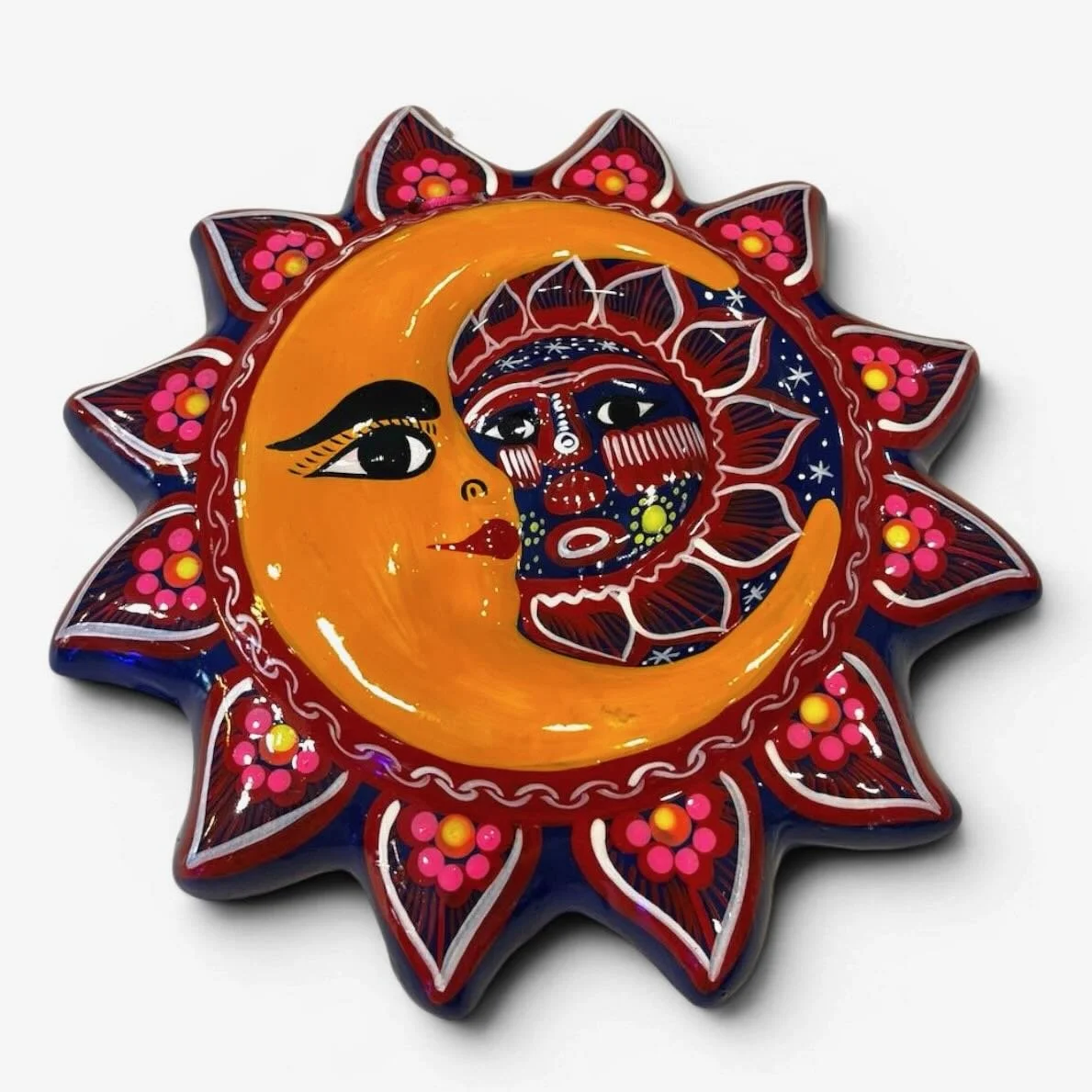 Handmade Mexican Talavera clay sun and moon wall art with vibrant hand-painted floral patterns.