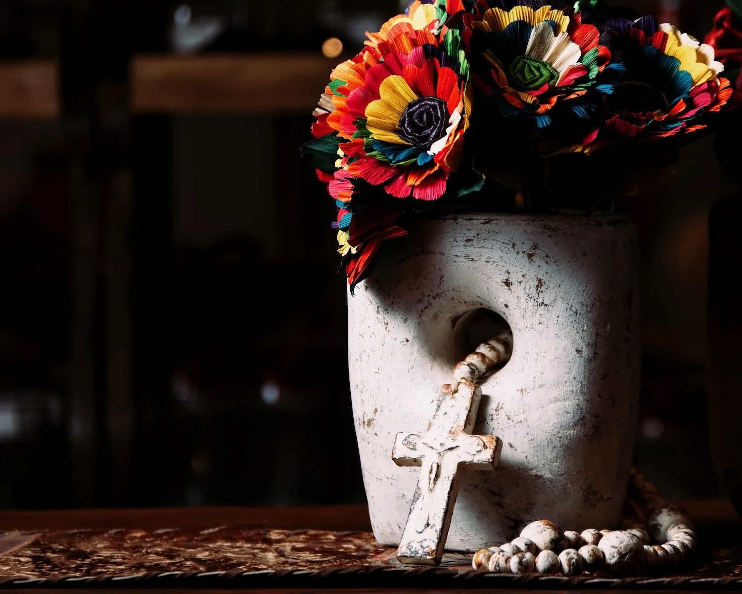 White Vase with Hole. Hand-sculpted Mexican clay vase with a unique hole-through-center design and distressed white finish.