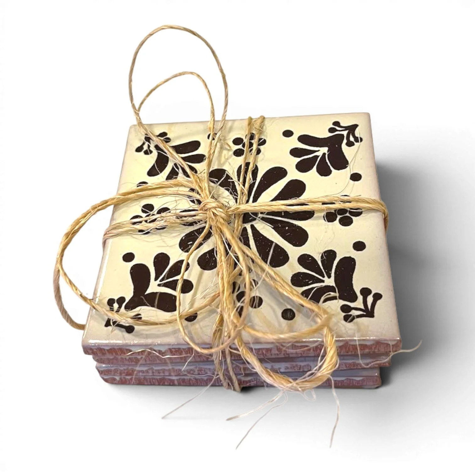 Set of four colorful Talavera tile coasters with hand-painted Mexican pottery designs