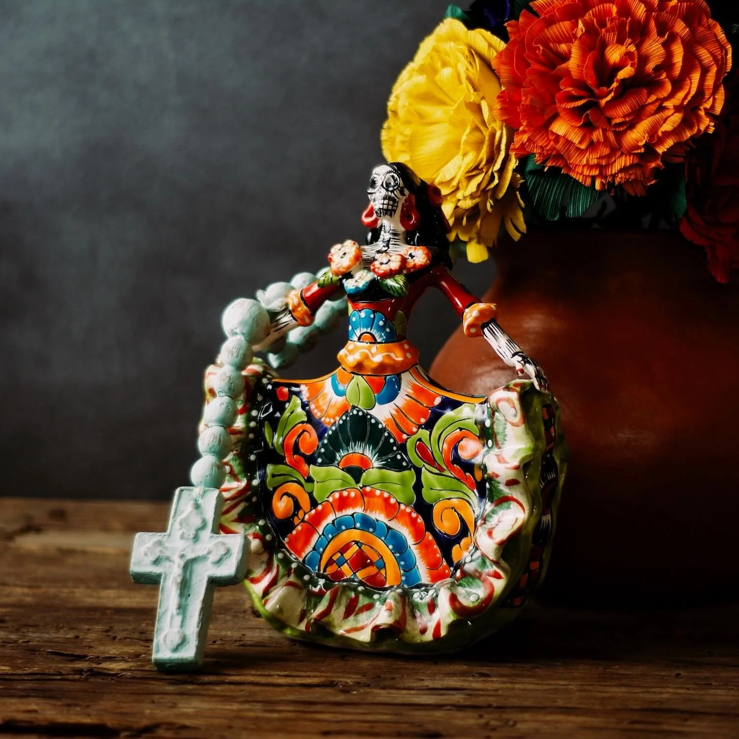 Handmade Talavera Catrina figurine with vibrant flowing dress