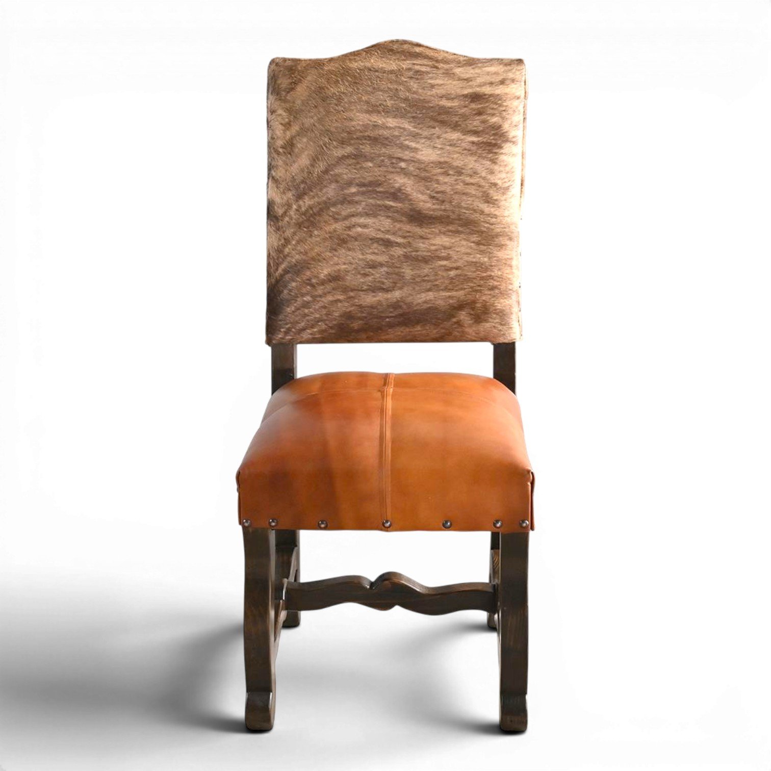 Handmade San Lucas terracotta leather and genuine cowhide dining chair with dark wood frame and decorative nailhead trim crafted in Mexico.