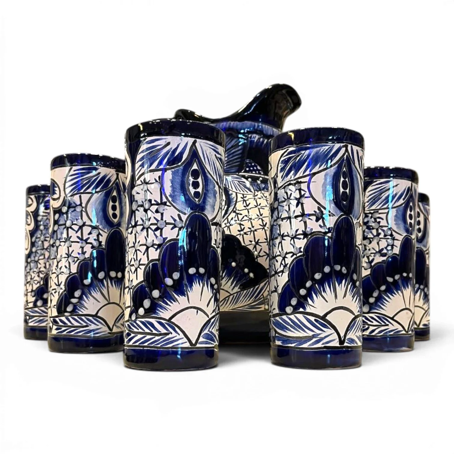 Handmade Mexican blue and white Talavera pitcher with six matching hand-painted tumblers.