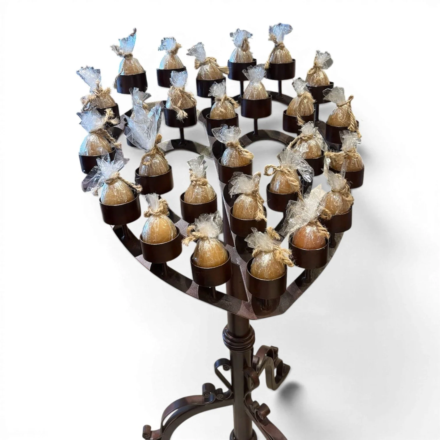 Handmade Mexican wrought iron heart candelabra centerpiece with bronze finish and elegant scrollwork