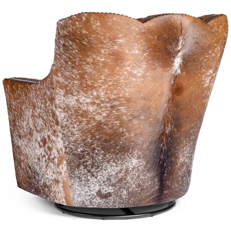 The Spotted Horse Leather & Cowhide Swivel Chair features premium leather, natural cowhide accents, and smooth swivel functionality for refined Western luxury and comfort.