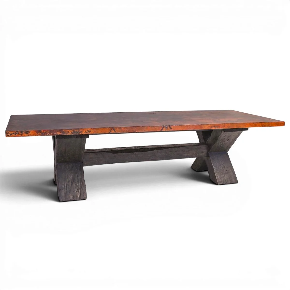 Artesia Copper Dining Table handcrafted in Mexico with hand-hammered dark copper top and solid wood X-shaped base.