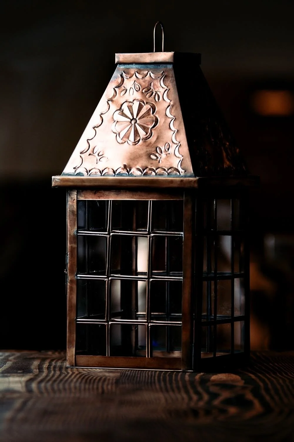 Linternas de Bronce - Shop handmade bronze lanterns from Mexico with glass panels and punched tin design. Elegant rustic lighting for tabletop or hanging display.
