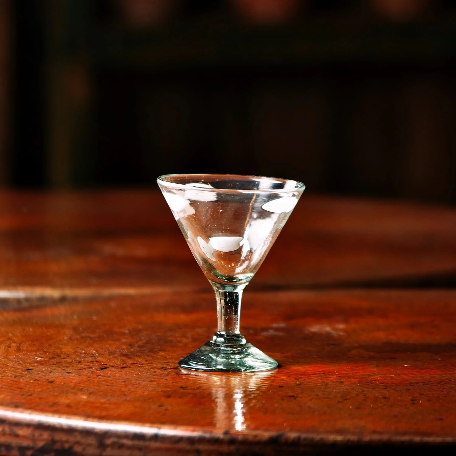 Handmade Mexican White Polka Dot Martini Glass with artisan swirl and textured glass design.