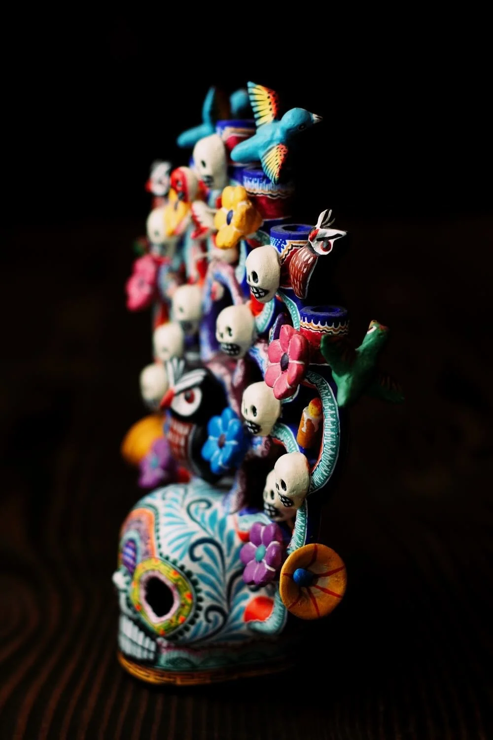 Shop a handmade Day of the Dead Tree of Life from Mexico. Colorful clay folk art with skulls, flowers, and candle holders for unique decor.