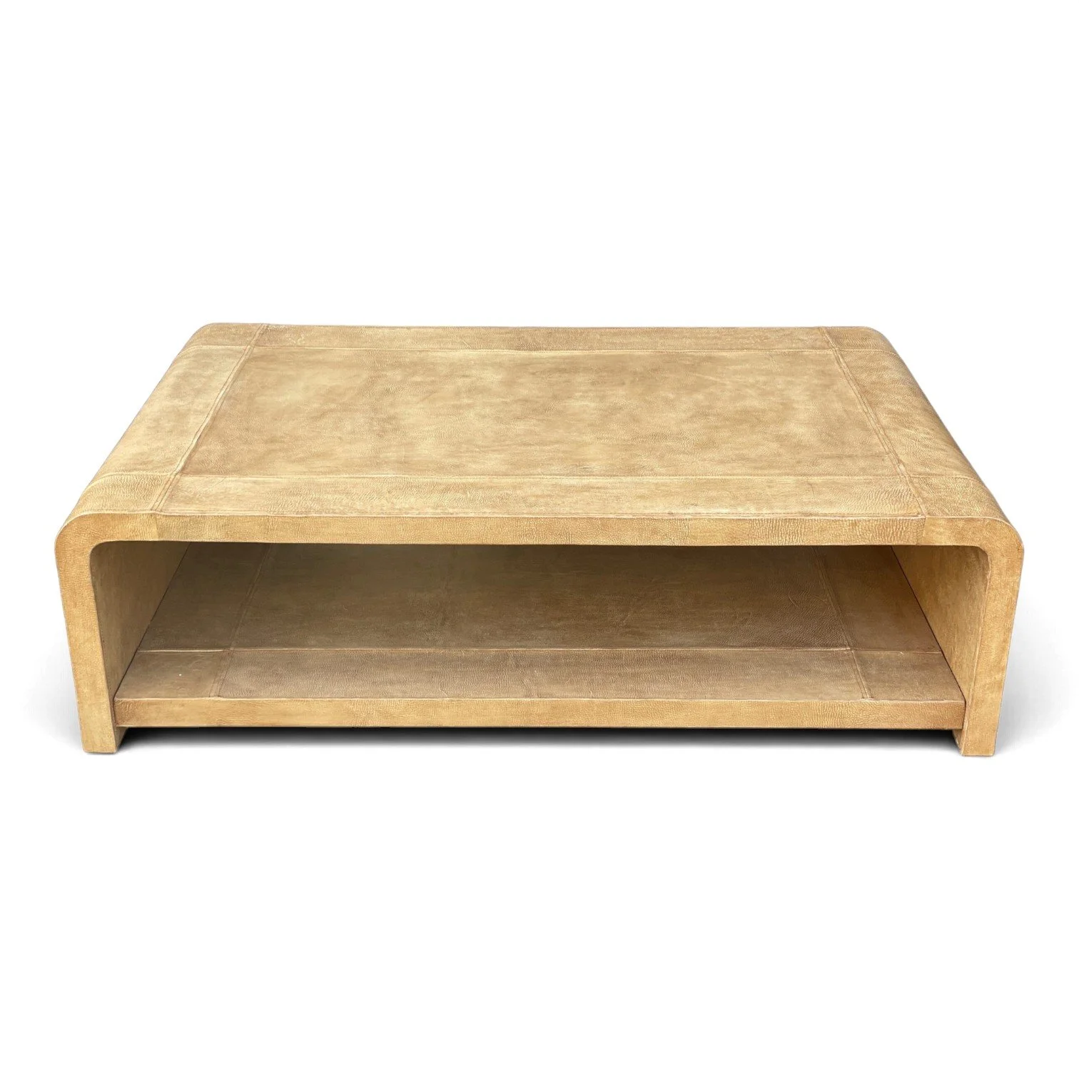 Handmade vegetable-tanned leather coffee table in natural tan with stitched detailing
