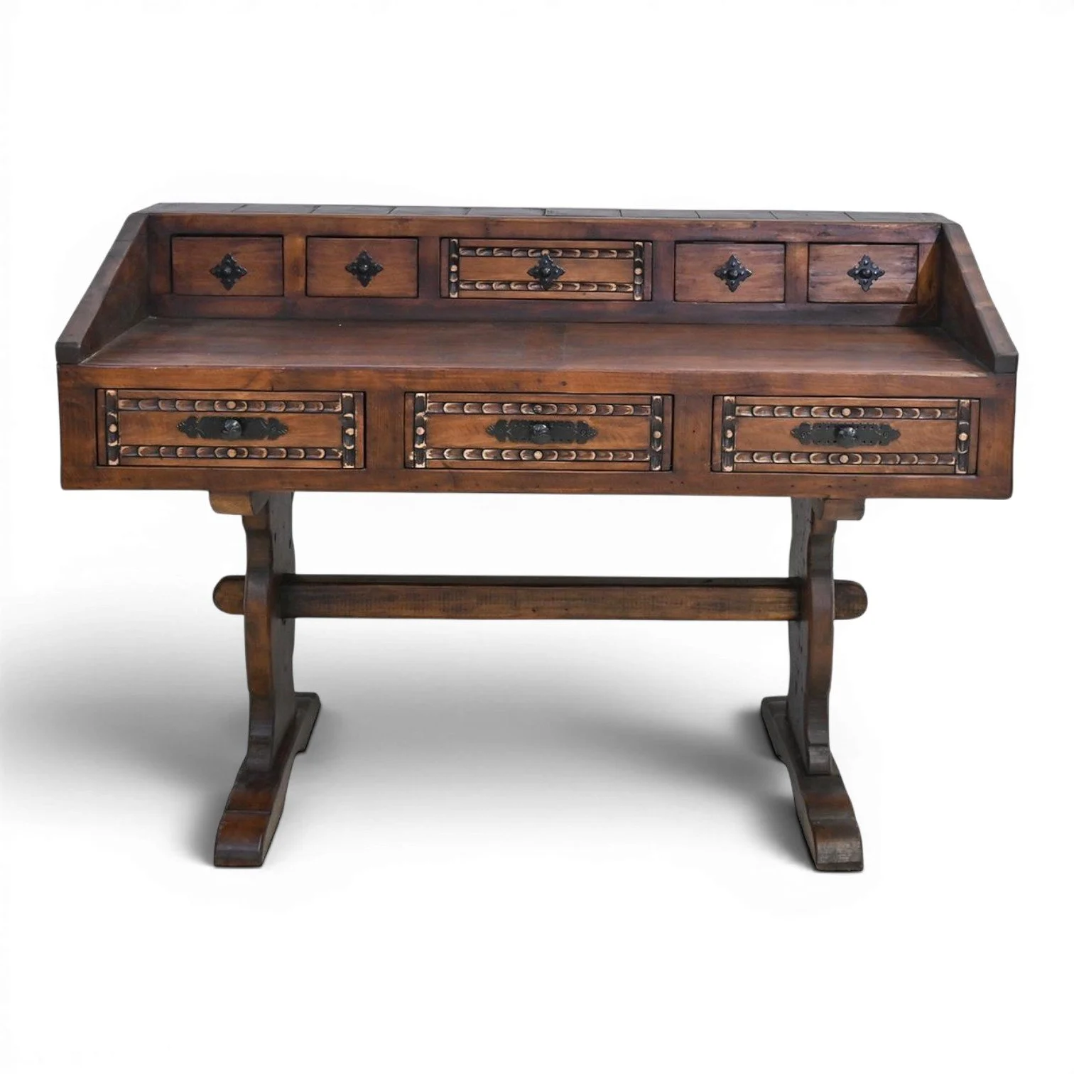 Handmade Mexican Las Carreras dark stained desk with hand-carved details, iron hardware, and multiple drawers