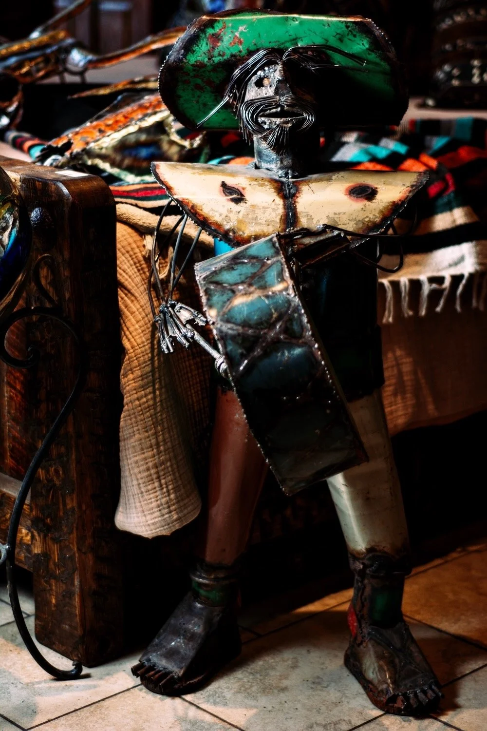Handmade recycled metal Mariachi playing the drums from Mexico. Visit Milagros Rústicos in Arizona today.