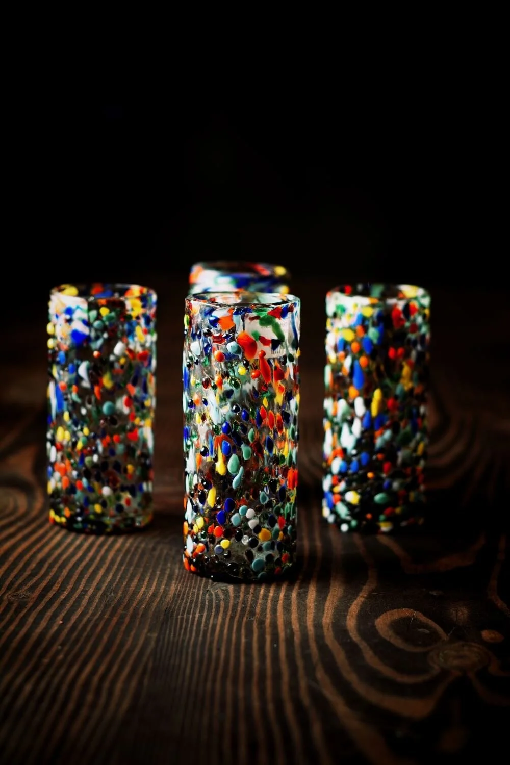 Shop a handblown Guanajuato Collins glass from Mexico. Colorful confetti design artisan drinkware perfect for cocktails and entertaining.