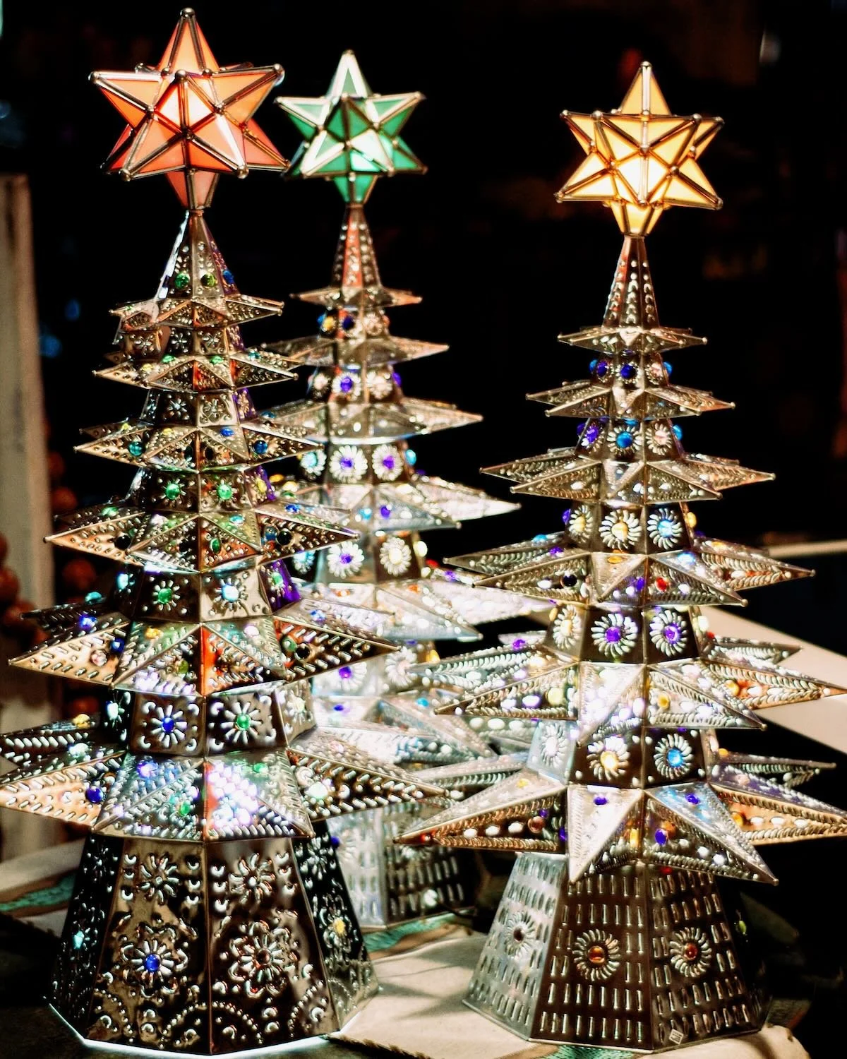 Handmade traditional silver lighted Christmas tree with colored marbles and star topper crafted in Mexico.