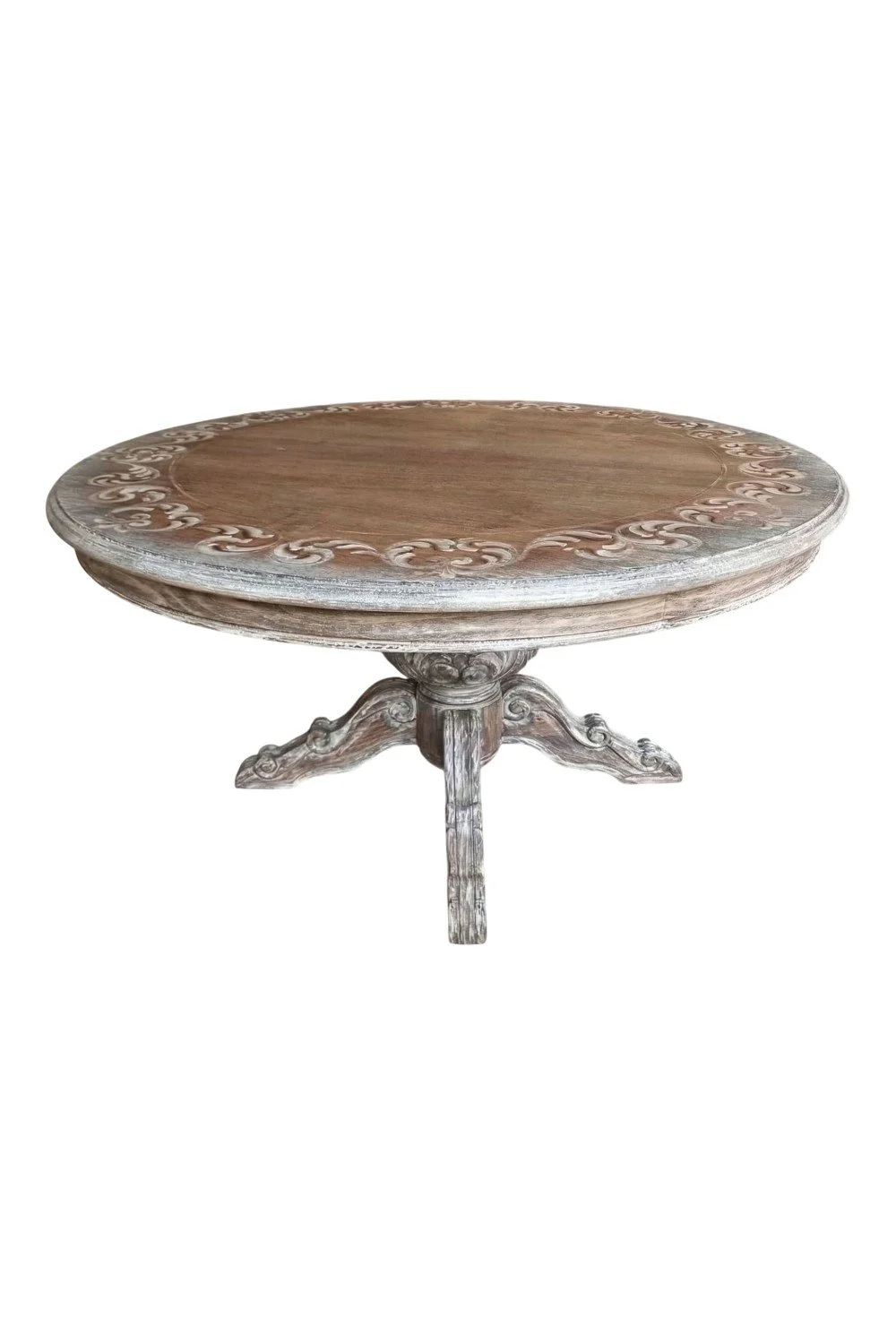Shop the Chambira Dining Table handmade in Peru. Round pedestal dining table with carved scroll details, Fairmont finish, and timeless European-inspired style.