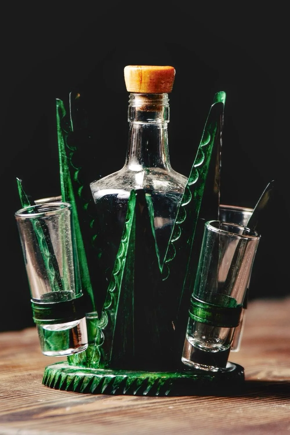 Shop the Agave Tequila Set Short handmade in Mexico. Festive metal tequila bottle and shot glass set in vibrant artisan green finishes.