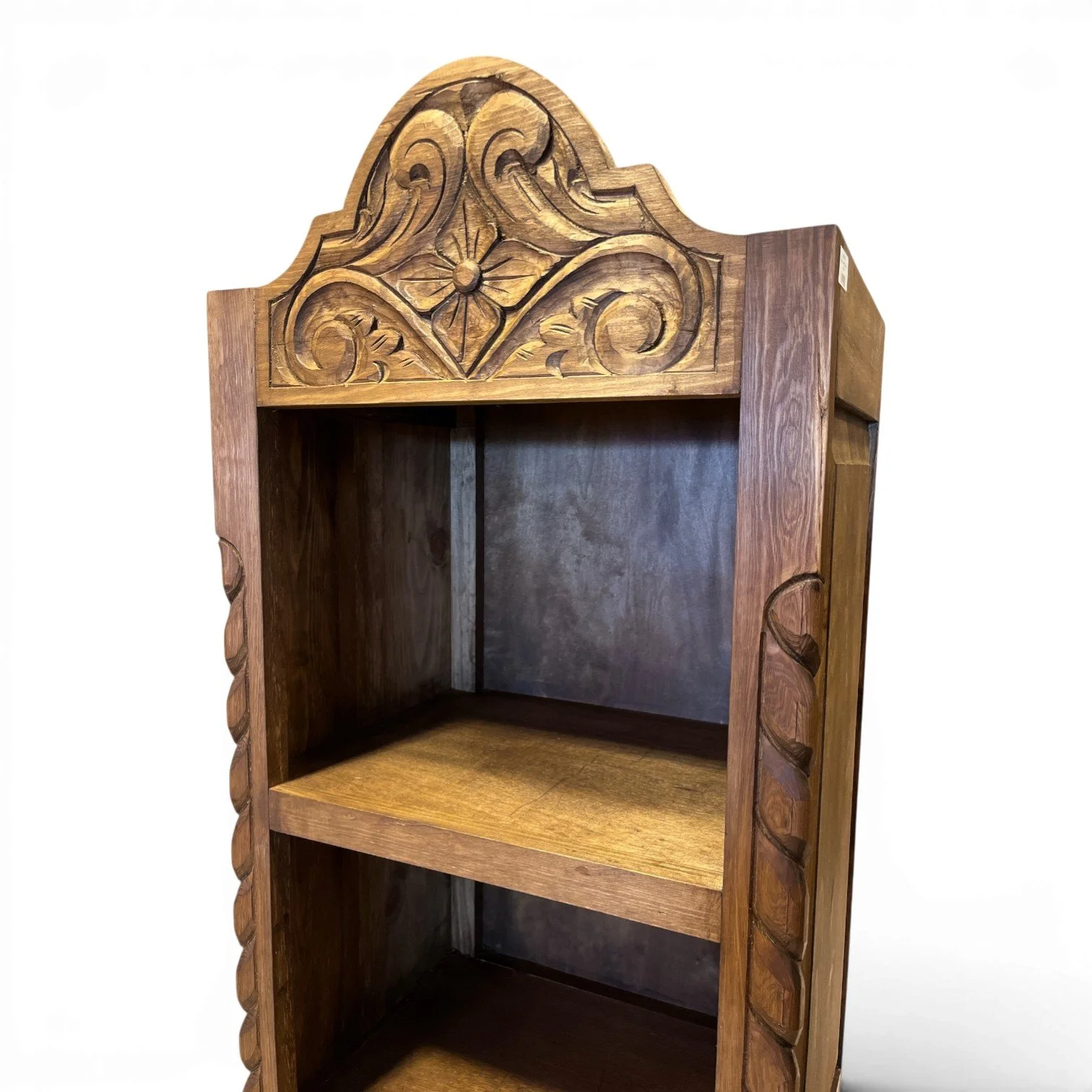Bisbee carved solid wood bookcase handmade in Mexico with intricate detailing and spacious rustic shelving.