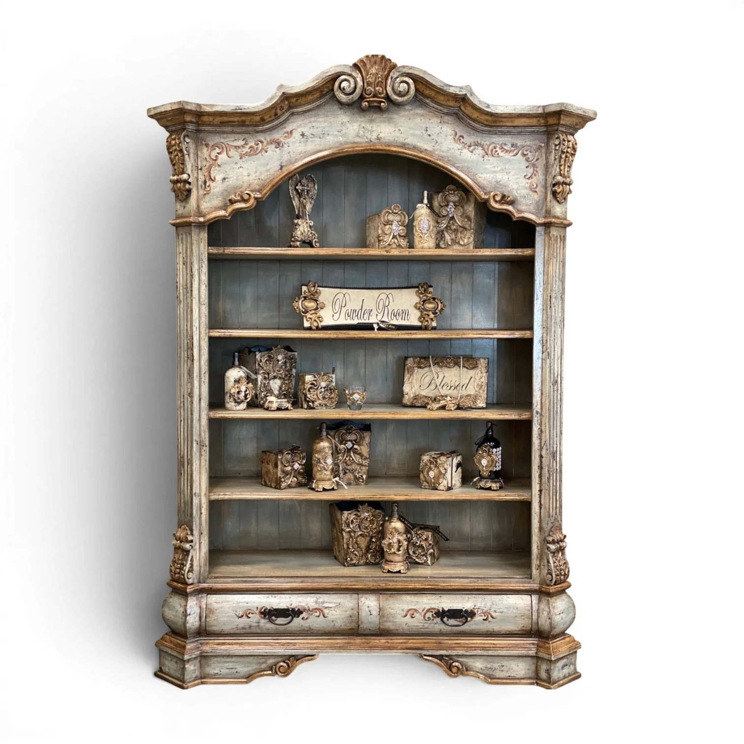 San Ignacio handmade Peruvian solid wood bookcase with hand-carved details, distressed Nanno finish, open shelving, and two lower storage drawers. Three