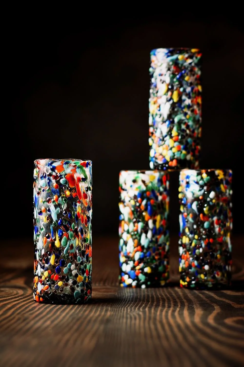 Shop a handblown Guanajuato Collins glass from Mexico. Colorful confetti design artisan drinkware perfect for cocktails and entertaining.