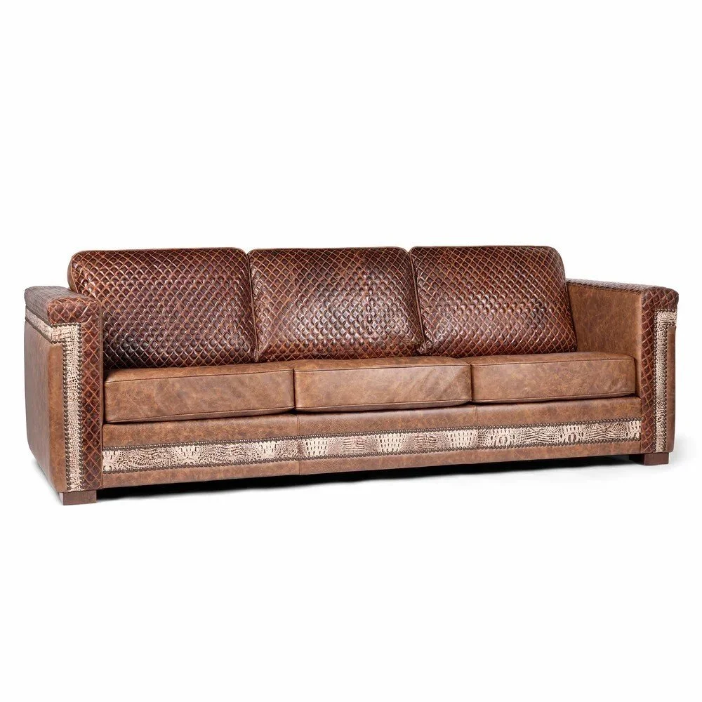 The Carson City Quilted Sofa with Croc Angle Leather features premium top-grain leather, croc-textured accents, quilted detailing, and handcrafted Western design for bold luxury and comfort.