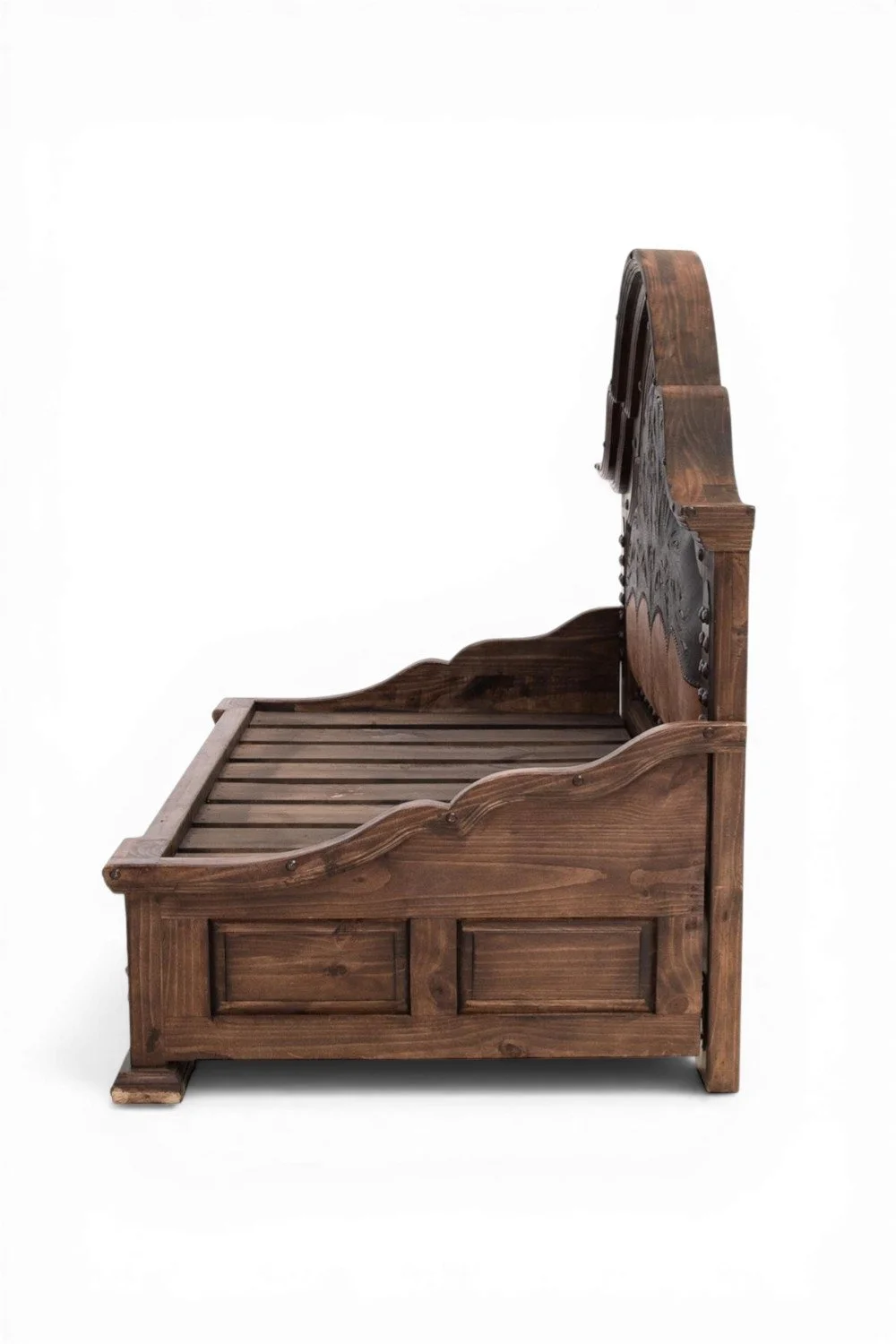 Shop a handmade wooden day bed from Mexico. Rustic hacienda-style design with carved details and iron accents for versatile home decor.