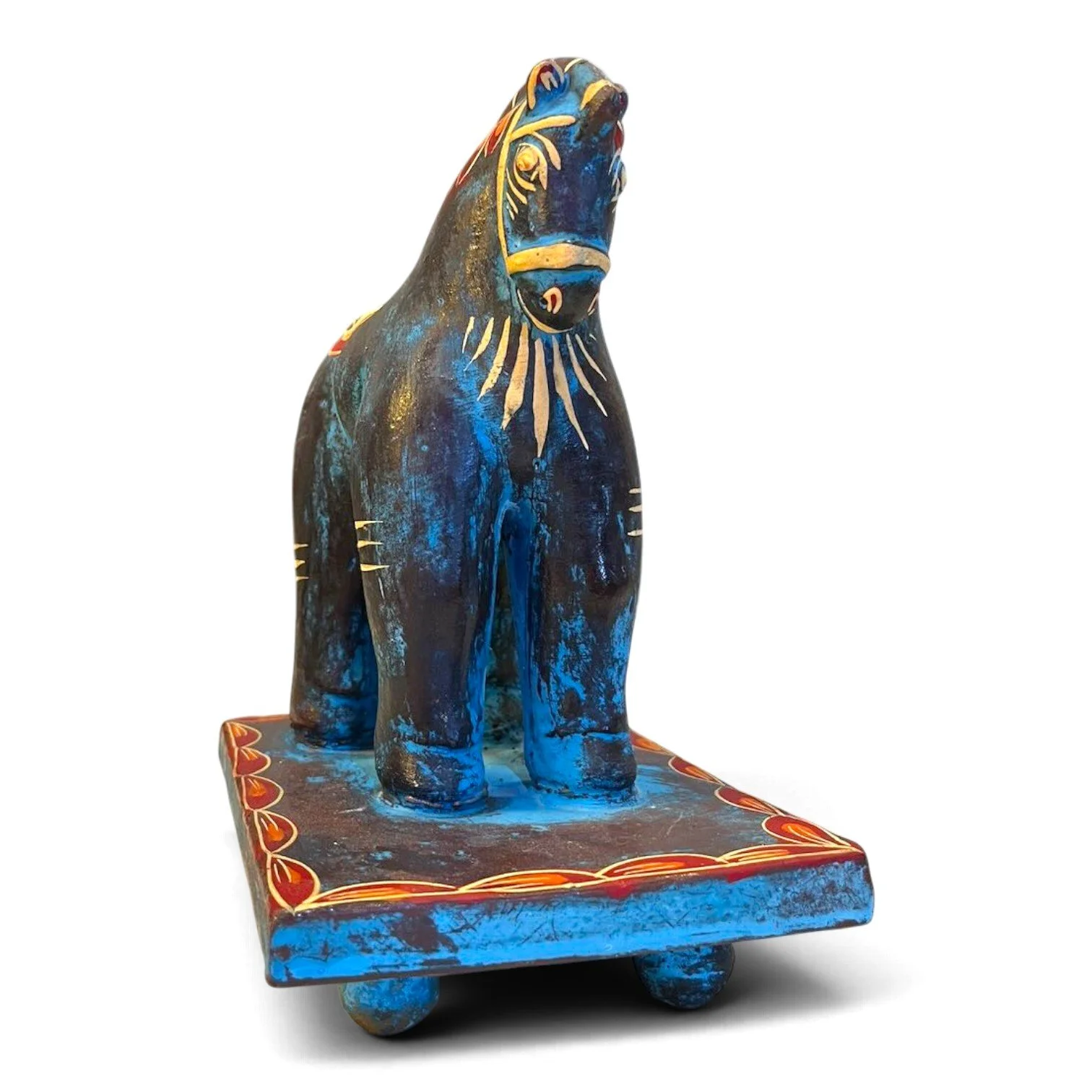 Handmade clay Trojan horse figure with unique hand-painted design on a pedestal
