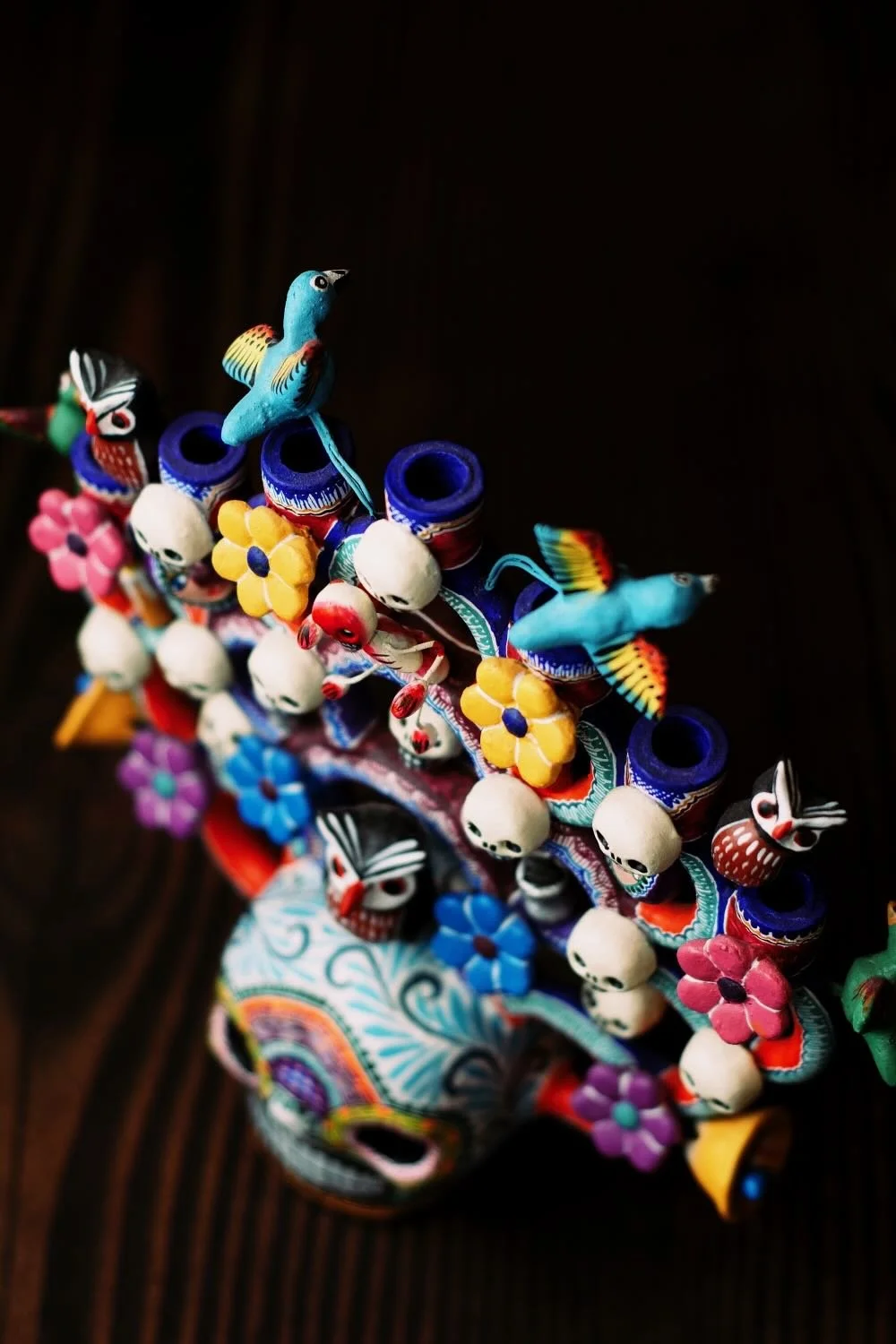 Shop a handmade Day of the Dead Tree of Life from Mexico. Colorful clay folk art with skulls, flowers, and candle holders for unique decor.