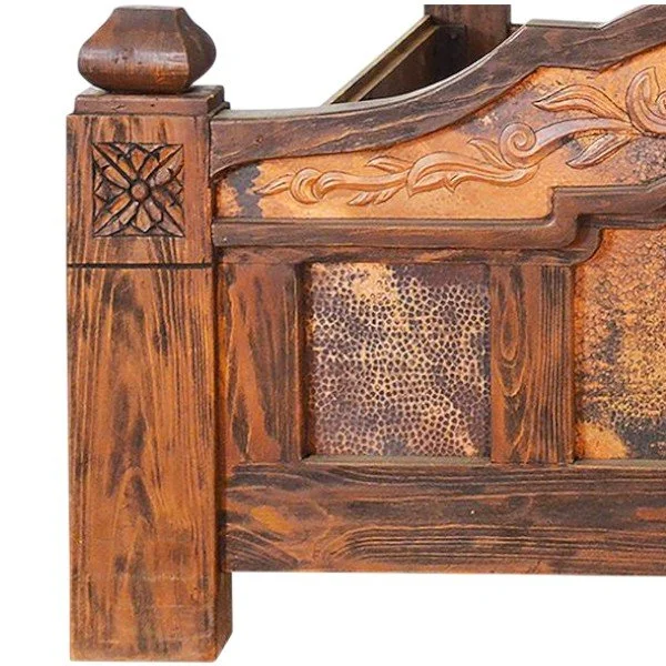 Handmade Margarita Dorada King bed with embossed golden copper headboard and footboard, hand-carved wood, and dark stained frame crafted in Mexico.