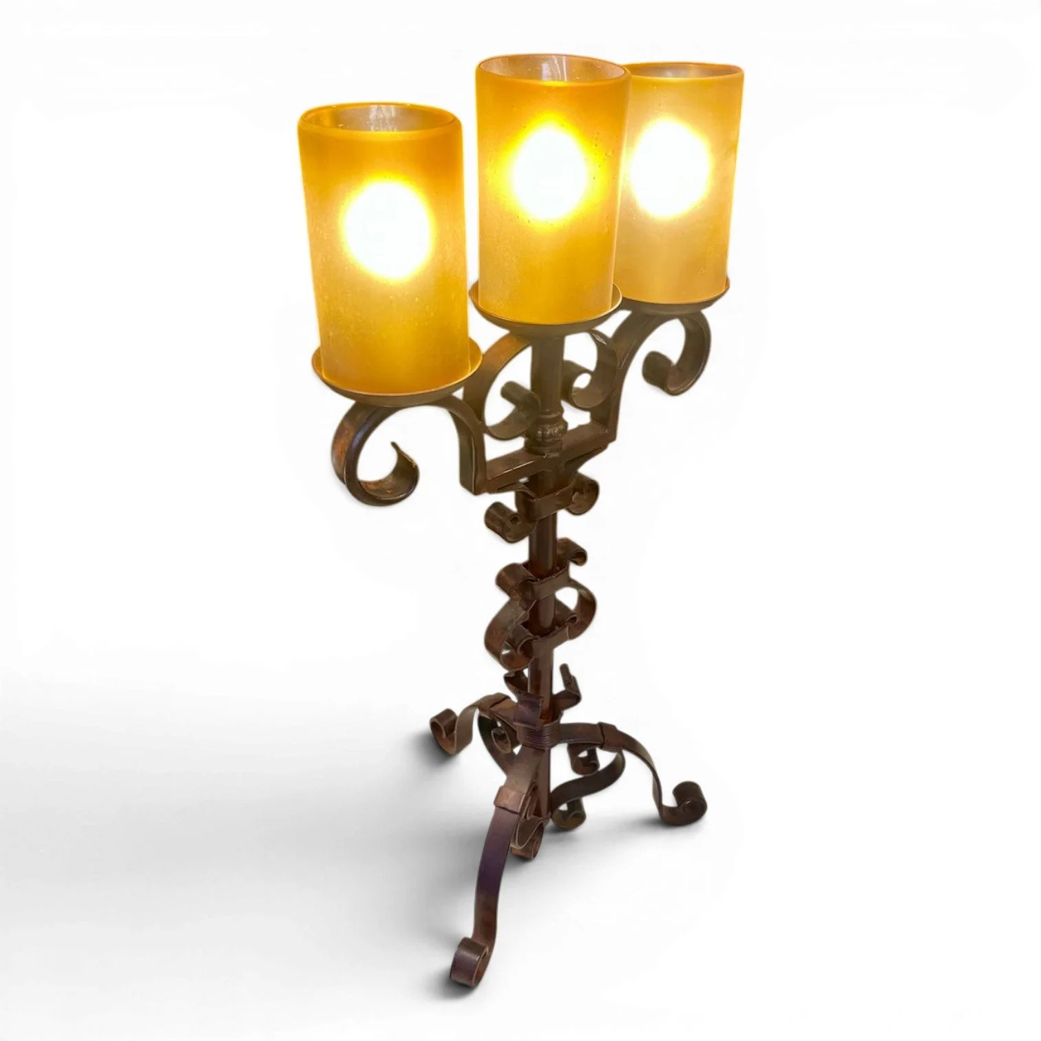 Handmade Mexican wrought iron scroll candelabra lamp with handblown amber glass shades