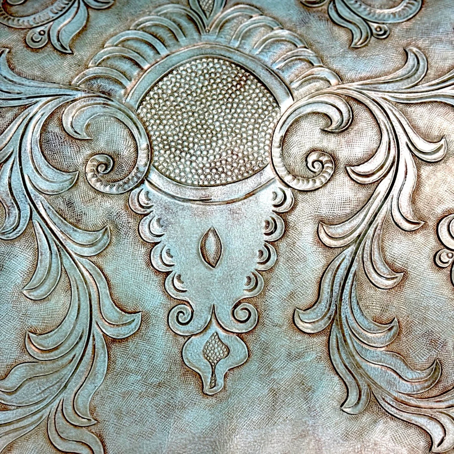 Handmade turquoise tooled leather bench with twisted wood armrests