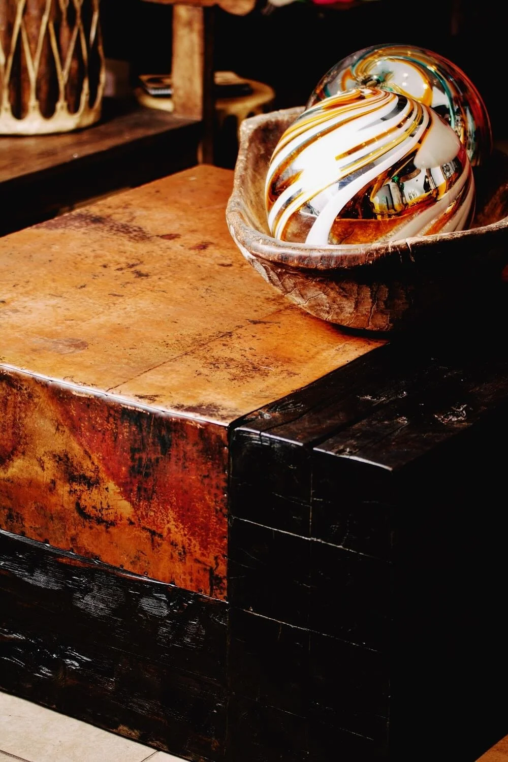 Handmade beam coffee table wrapped in hand pounded natural copper from Mexico.