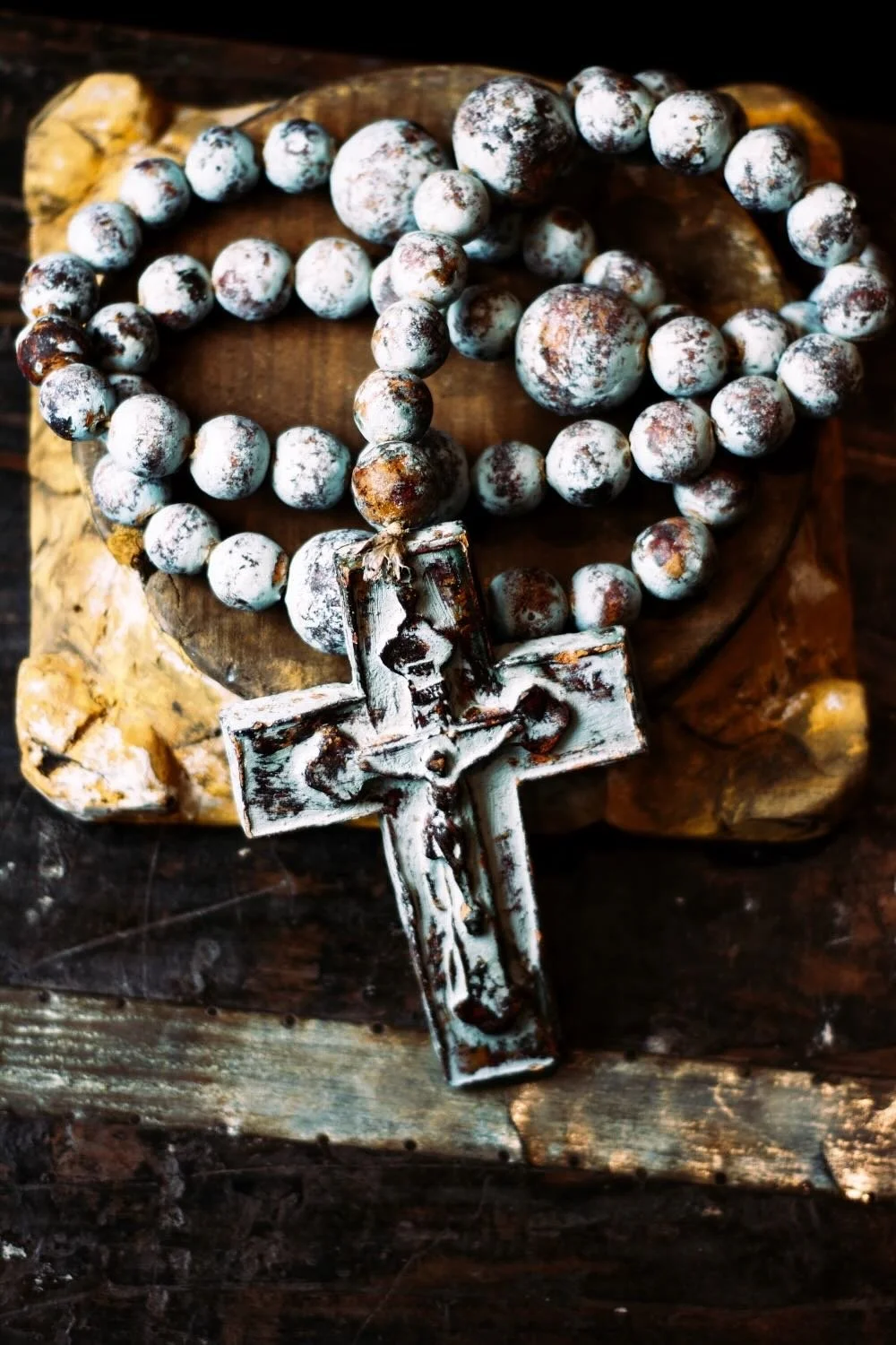 Rosario de Barro - Turquoise. Oversized 45" turquoise clay rosary from Milagros Rústicos. Handcrafted in Mexico with a distressed finish. Ideal for large-scale decor.