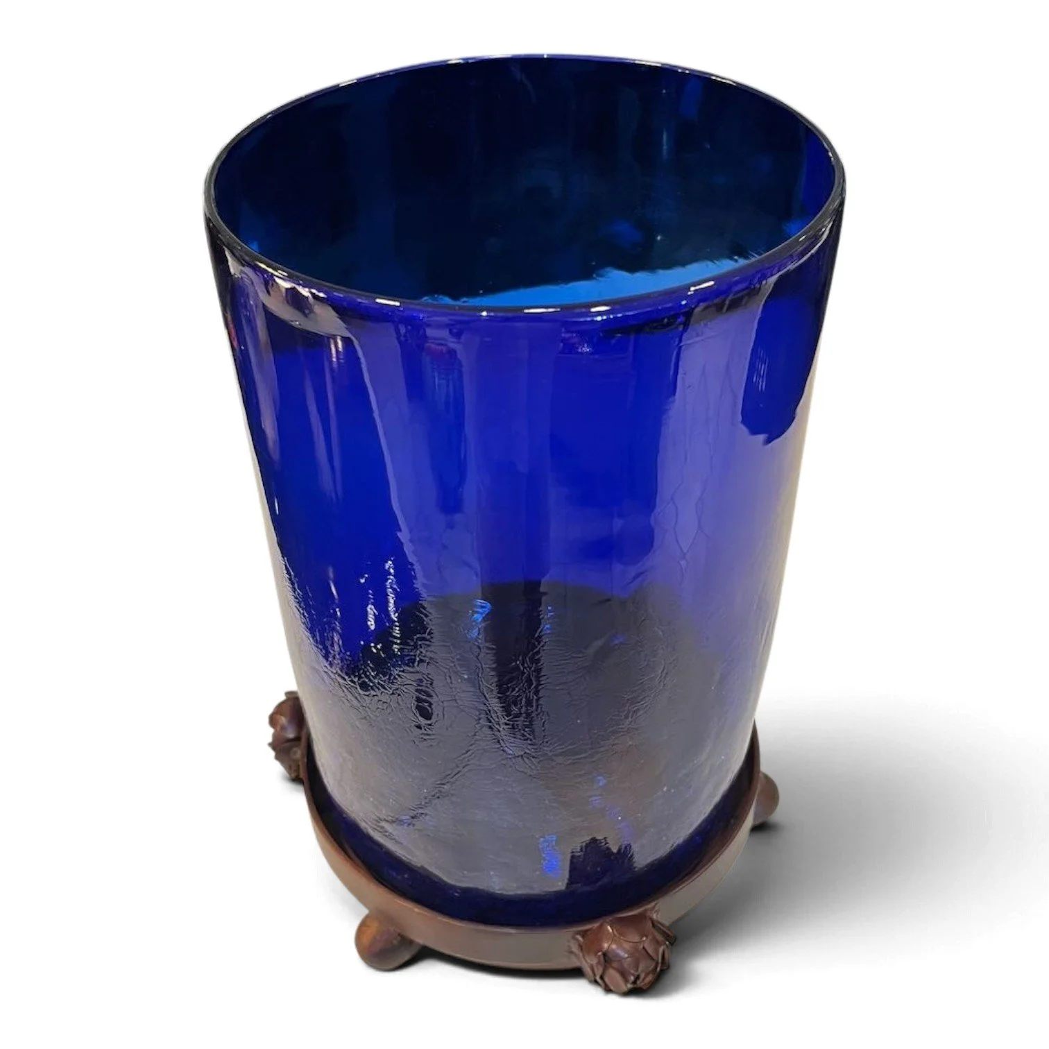 Handmade cobalt blue glass candelabra on a round wrought iron tray with metal roses