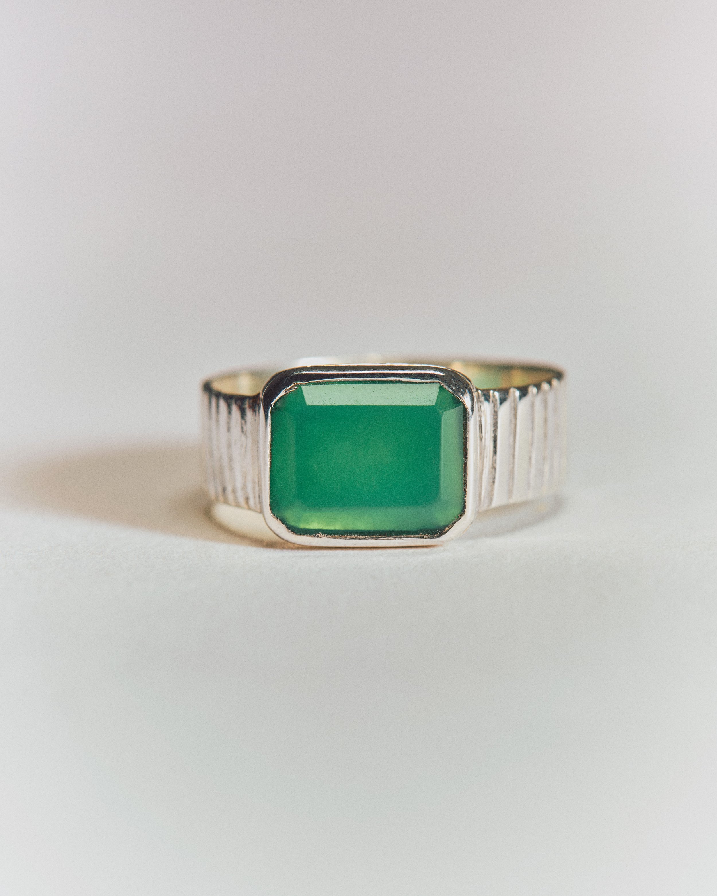 Silver ring with a square green stone