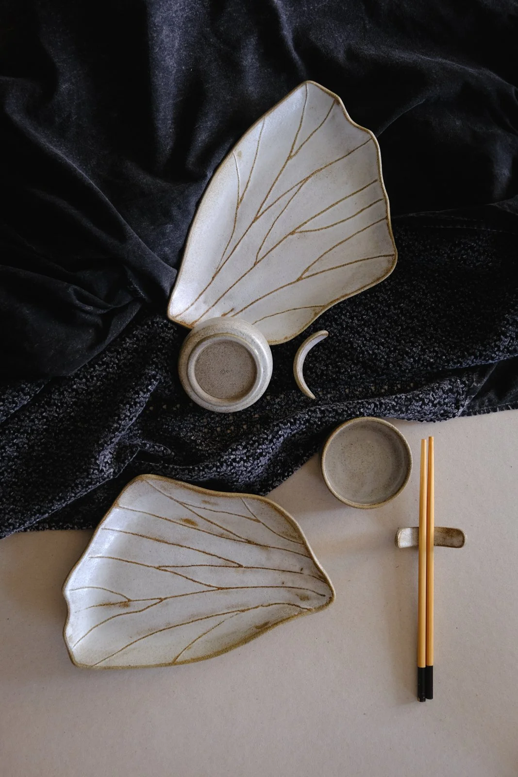 Sushi set in stone grey clay and off-white rustic wabi-sabi finish.