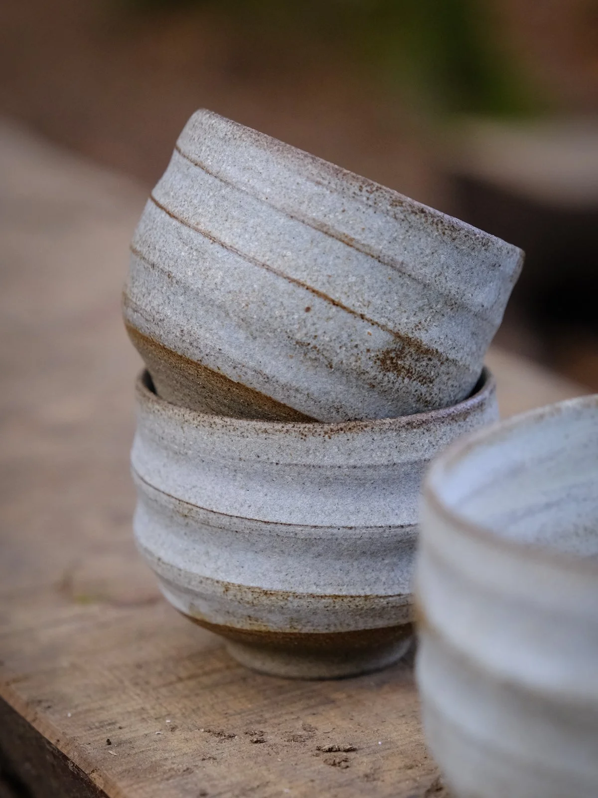 Opaque stone-like grey surfaces on swirly vessel collection.
