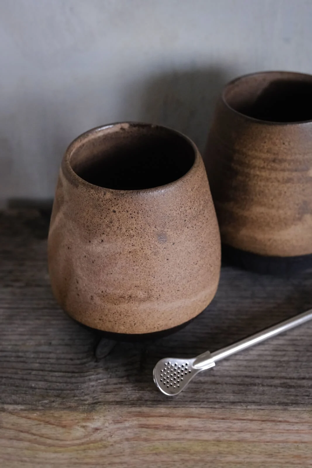 mate cups for tea rituals in black clay and matte stone glaze with included and bombilla.