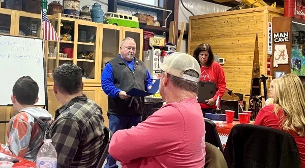 President Mark Smith announcing recipients of special awards.