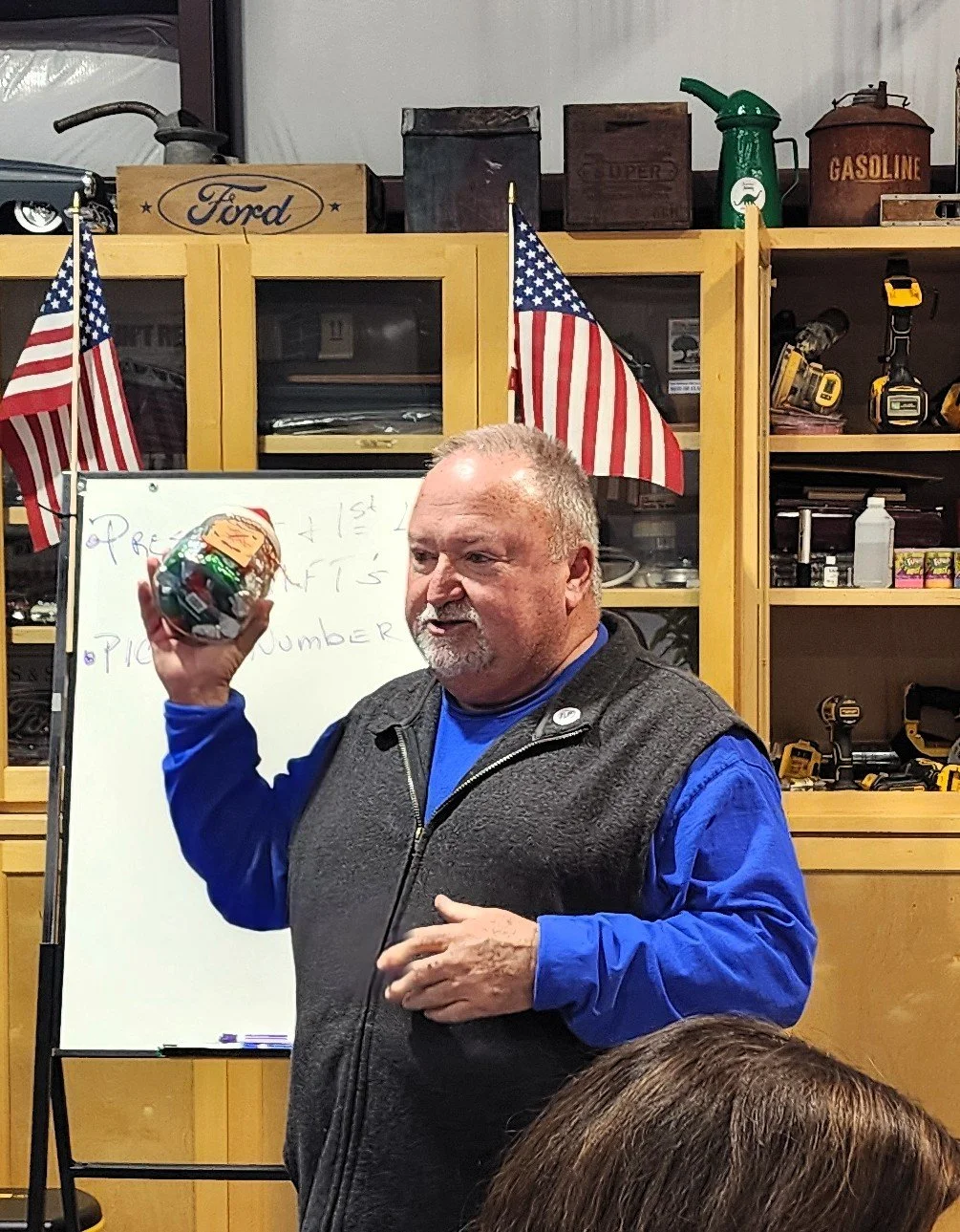 President Mark Smith explaining the "guess the kisses" game.