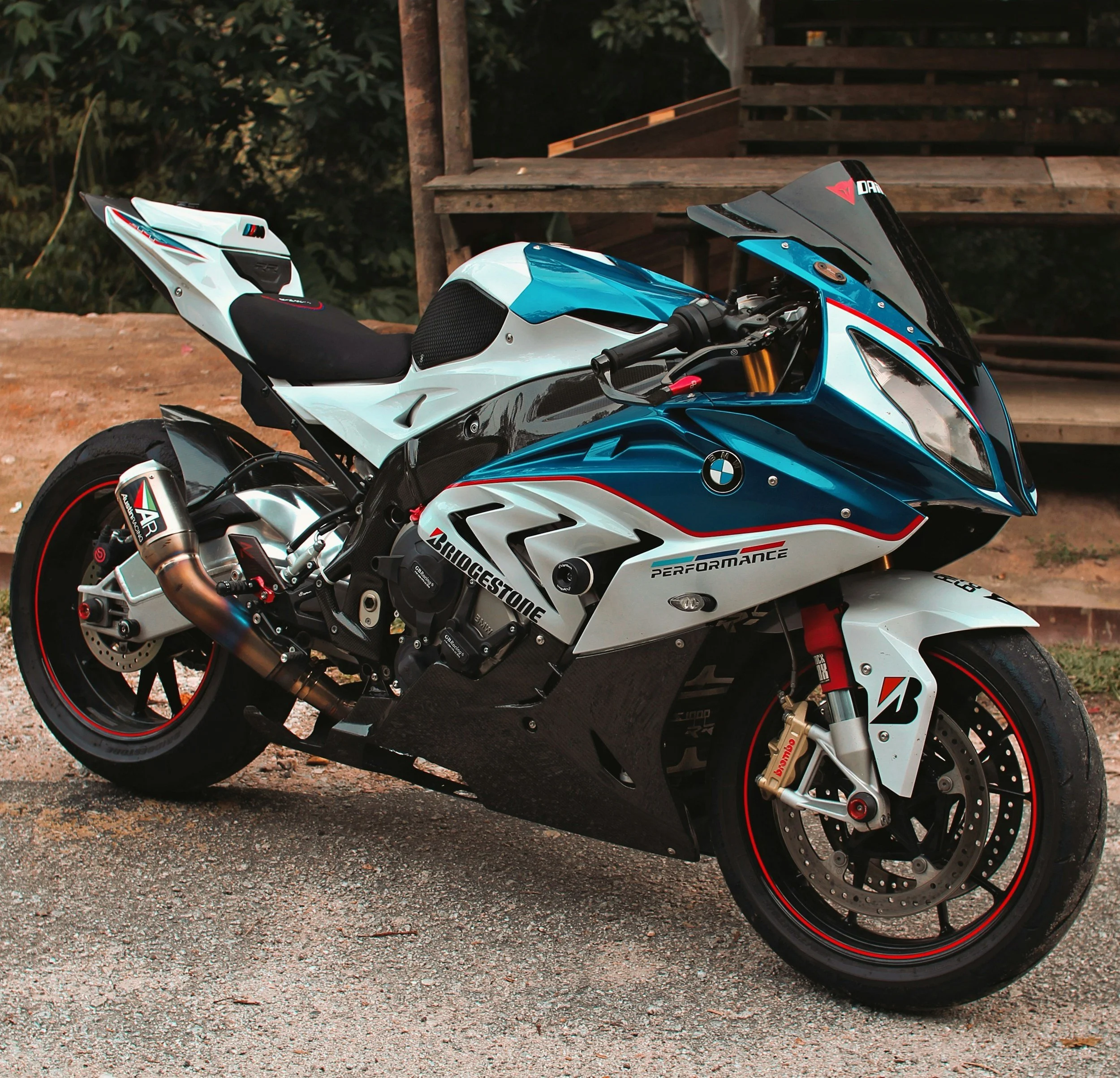 Blue and white sport motorcycle with a high-gloss Nano Diamond 10H ceramic coating. Provides full-body protection against gravel chips, bug splatter, and sun damage for riders in Kelowna and the Okanagan.