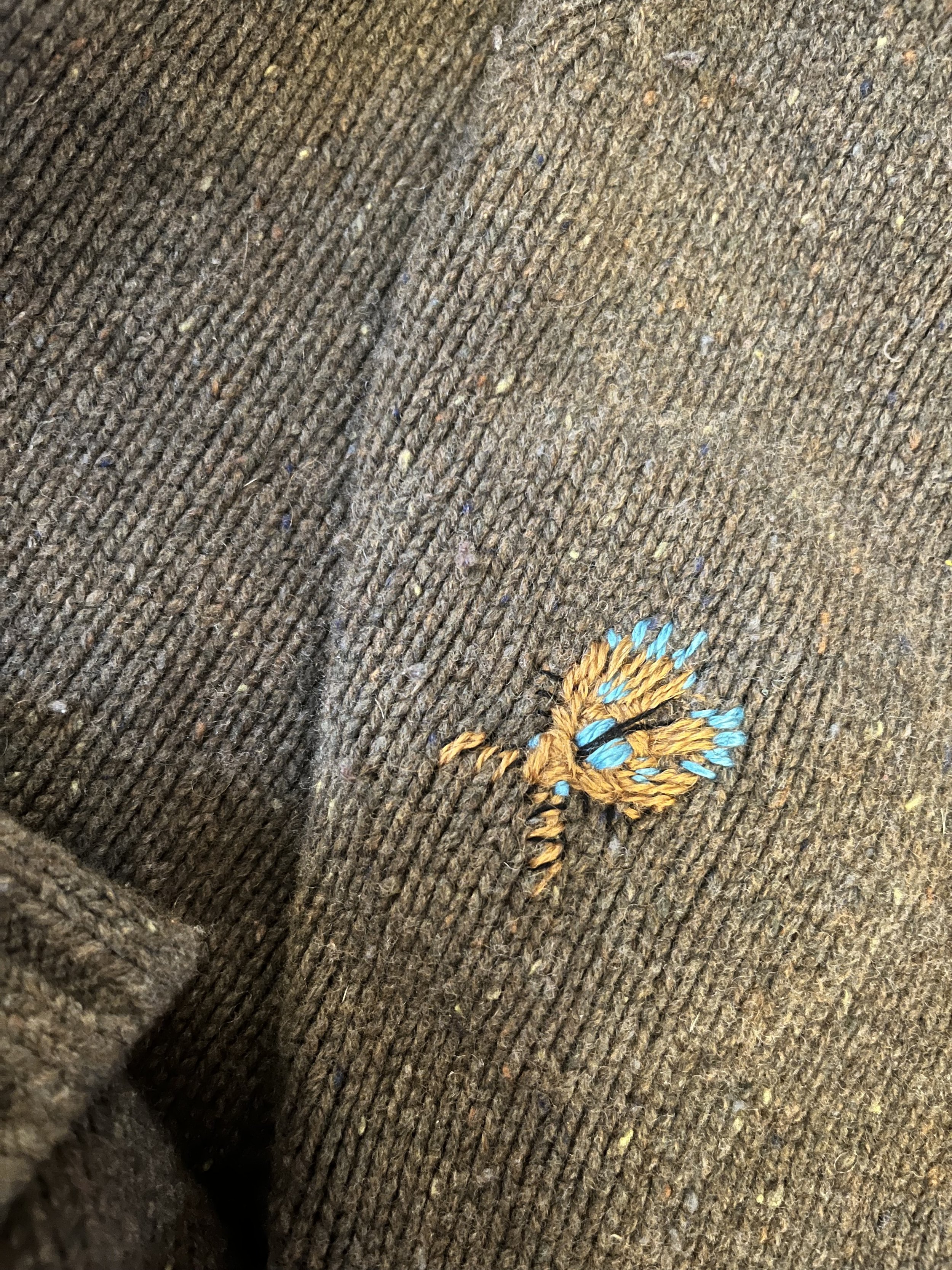 cotton thread on wool sweater