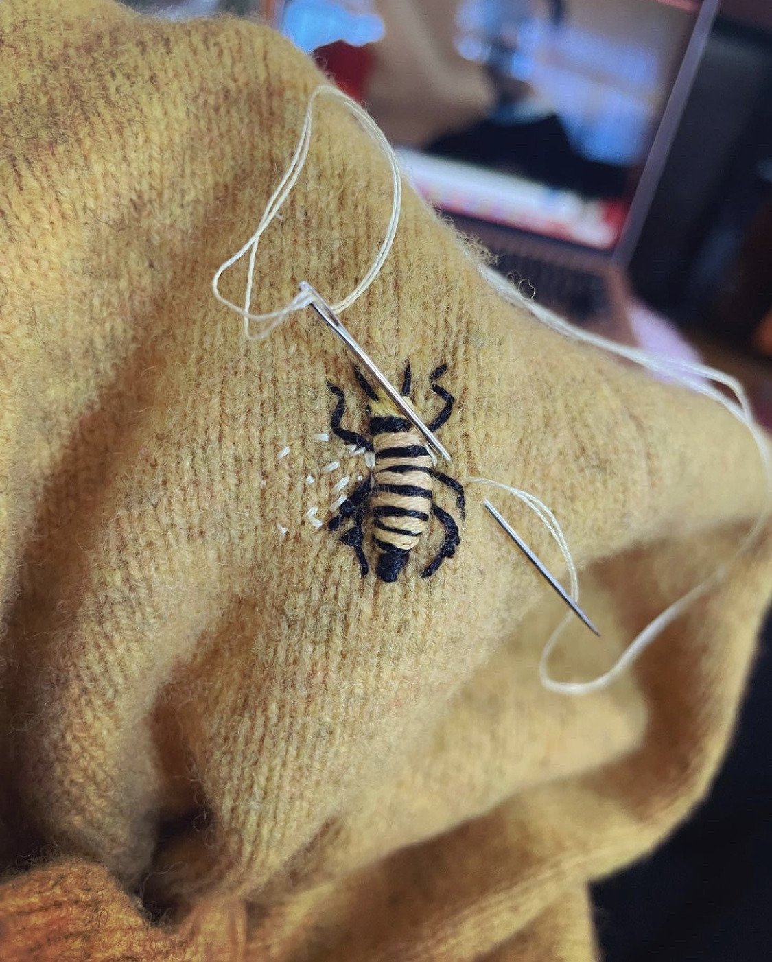 cotton thread on wool sweater