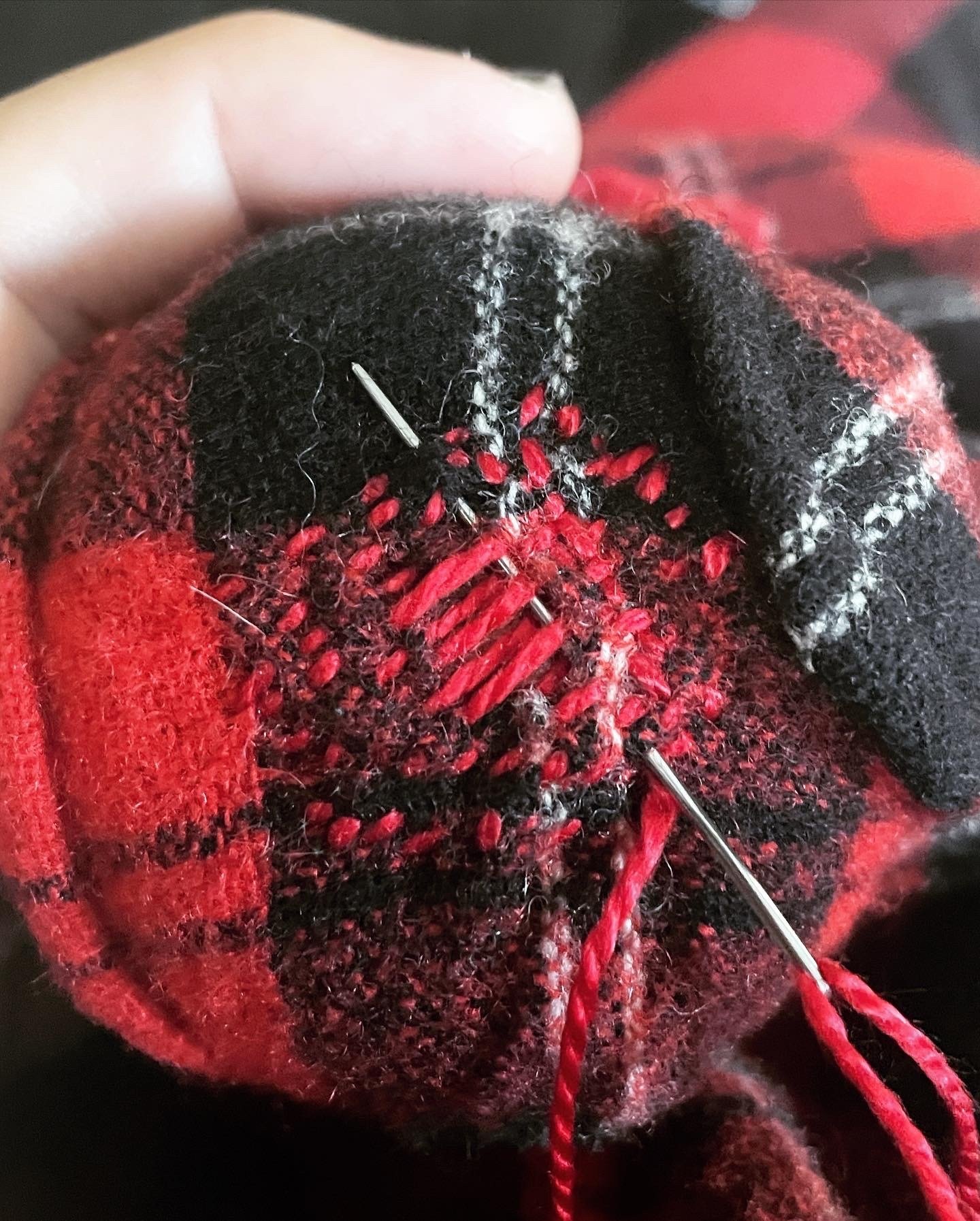 silk thread darning on wool flannel shirt