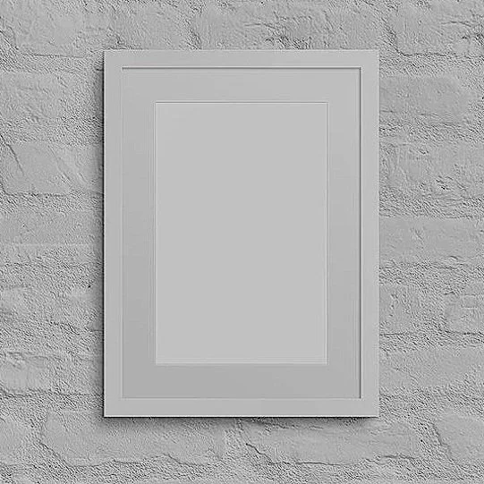 Blank picture frame on a brick wall