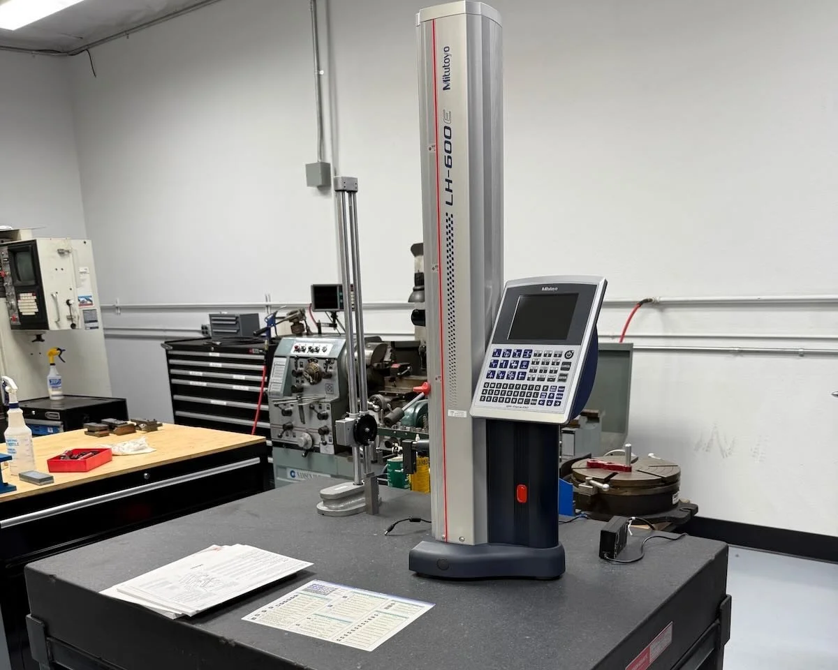 Mitutoyo LH-600 height gauge on a granite surface plate at Papadakis Engineering.