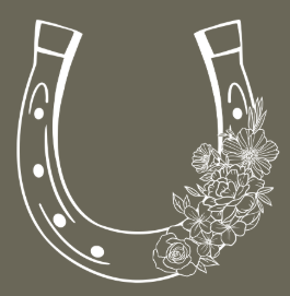 A white horseshoe decorated with flowers on a gray background.