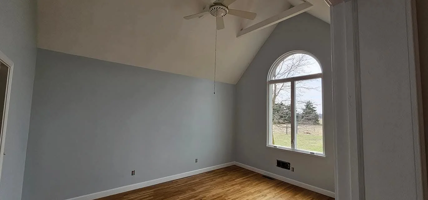 After imag of master bedroom with a fresh coat of paint and finishing